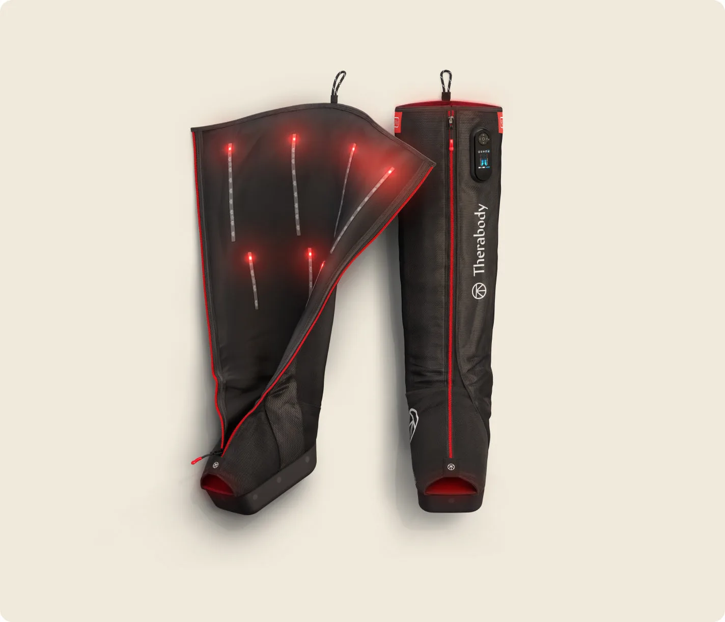 Therabody JetBoots PRO Plus pair, one boot unzipped, on off-white
